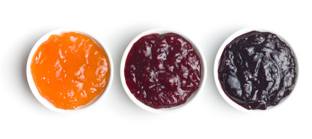 Tasty fruity jam in bowl isolated on white background. Top view.の写真素材