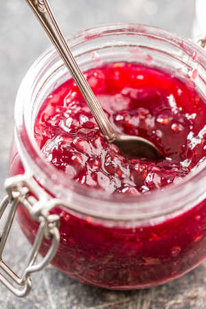 Raspberry jam jelly in jar.