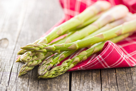 Fresh green asparagus on old wooden table.の写真素材