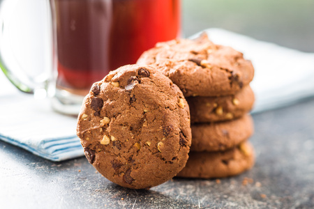 Tasty chocolate cookies on old kitchen table.