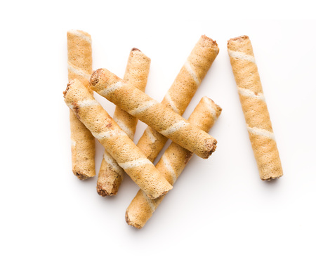 Sweet chocolate waffle rolls isolated on white background.の写真素材