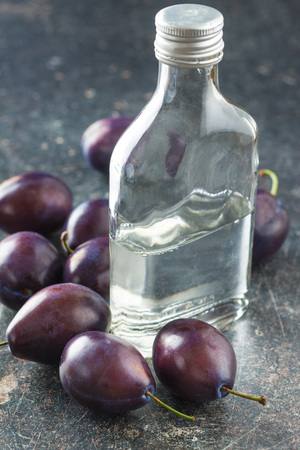 Plum brandy and plums. Tasty slivovitz.の写真素材