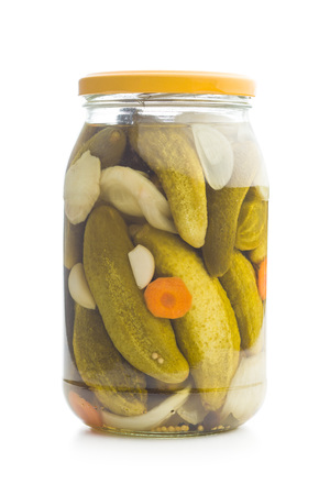 Pickled cucumbers in jar isolated on white background.の写真素材