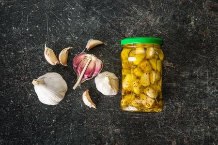 Marinated garlic. Pickled garlic in jar.の写真素材
