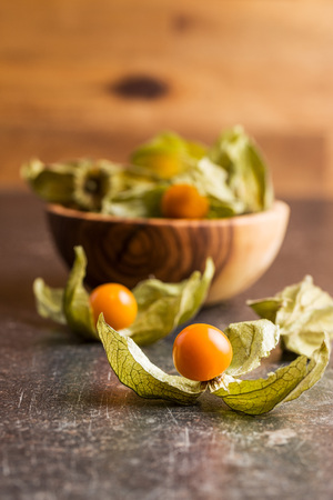 Physalis peruviana fruit on old kitchen table.の写真素材