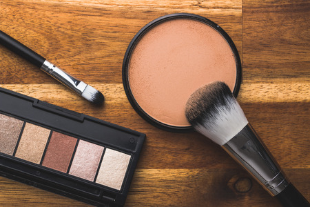 The makeup powder and brush. Make-up accessories. Top view.の写真素材