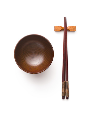 Wooden bowl and chopsticks isolated on white background.の写真素材