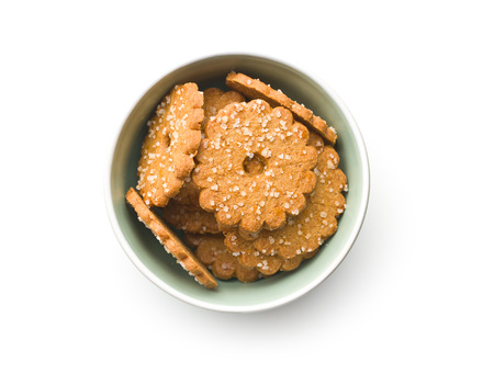 Christmas biscuits with sugar crystals in bowl isolated on white background. Top view.の写真素材