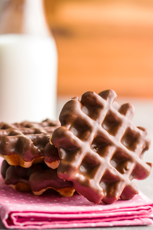 Waffles with chocolate topping. Sweet chocolated dessert.の写真素材
