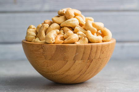Roasted cashew nuts in bowl.の写真素材
