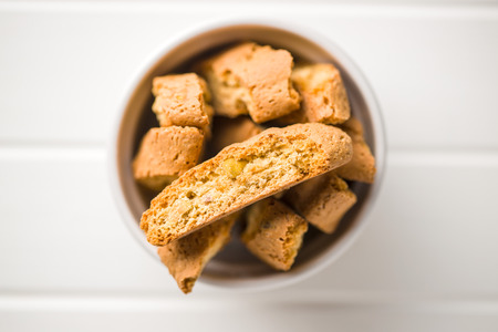 Sweet cantuccini biscuits. Italian biscotti in bowl. Top view.