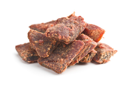 Beef jerky pieces isolated on white background. Marinated dried meat.の写真素材
