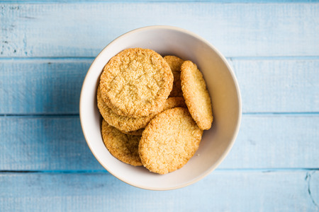 Crispy oatmeal cookies in bowl.