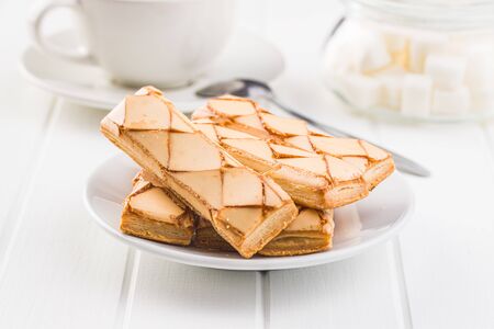 Sweet biscuits. Tasty dessert on white wooden table.