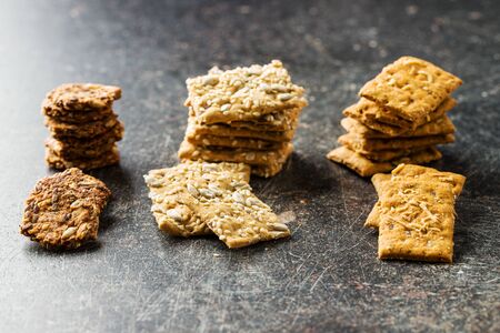 Salted crispy crackers on old kitchen table.の写真素材