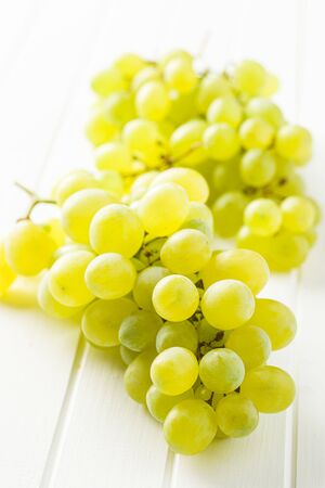 Tasty green grapes. White grape on white table.の写真素材