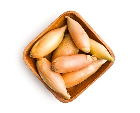 The golden shallot onion isolated on white background. Fresh bulbs.の写真素材