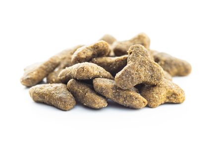 Dry kibble pet food. Kibble for dog or cat isolated on white background.