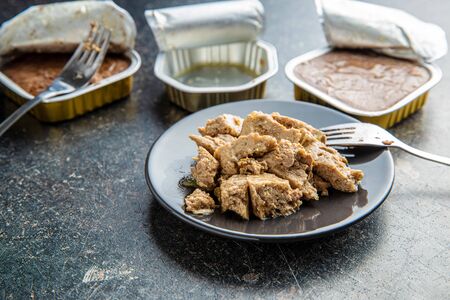 Wet pet food. Cat or dog pate on plate.