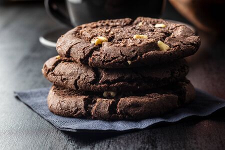 Sweet chocolate cookies on black table.の写真素材