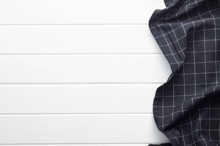 Black tablecloth over white table. Top view of tablecloth border.の写真素材