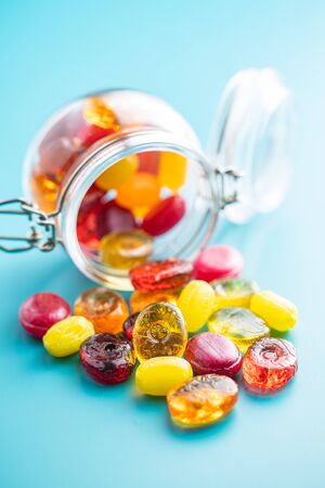 Sweet colorful candies on blue background.の写真素材