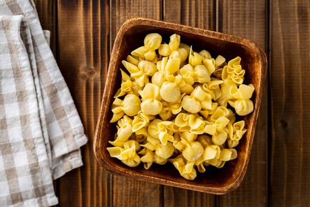 Italian stuffed pasta. Sacchettini pasta in bowl.の写真素材