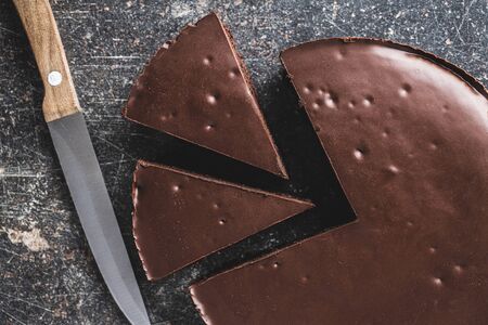 Chocolate brownies cake on old kitchen table.の写真素材