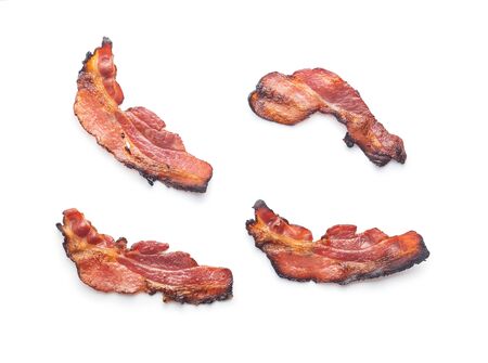 Fried bacon. Sliced roasted bacon isolated on white background.の写真素材