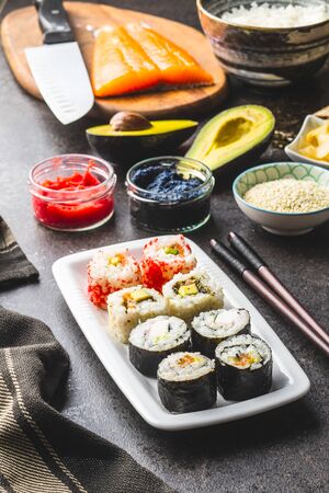 Japanese sushi food. Maki and california roll sushi with salmon, caviar, avocado, tuna and wasabi with ginger.の写真素材