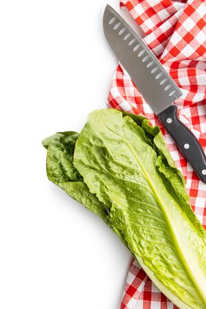 Fresh green Romaine Lettuce, knife and checkered napkin. Leaves of Lactuca sativa isolated on white background.の写真素材
