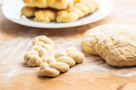 Unbaked braided bun dough. Raw dough. Unbaked buns.の写真素材