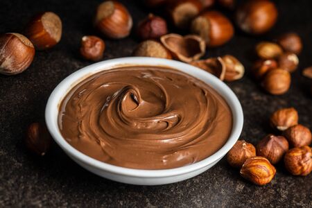Sweet hazelnut spread. Chocolate cream in bowl.