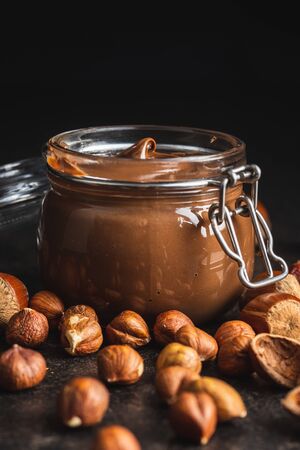 Sweet hazelnut spread. Chocolate cream in jar.