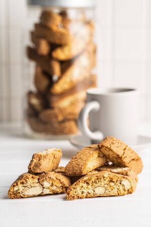Sweet italian cantuccini cookies. Almonds biscuits on white table.の写真素材