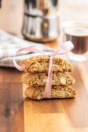 Sweet italian cantuccini cookies. Almonds biscuits on wooden table.の写真素材