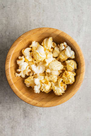 Sweet tasty popcorn in bowl. Top view.