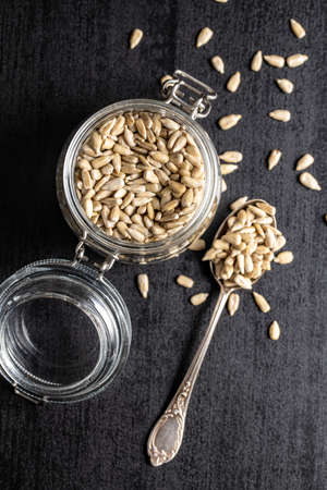 Peeled sunflower seeds in jar. Top view.の写真素材