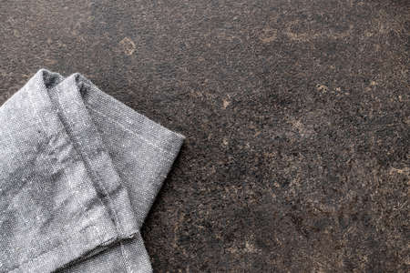 Kitchen towel on black table. Napkin on black background. Top view.の写真素材