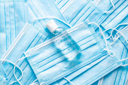 Antibacterial hand gel and face masks. Coronavirus protection. Top view.の写真素材