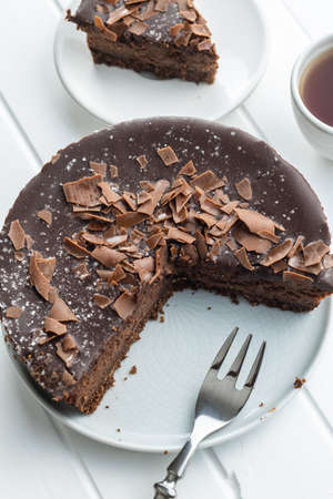 Sweet chocolate cheese cake on white wooden table.の写真素材