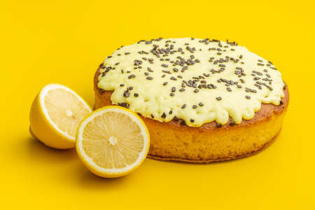 Sweet lemon cake with lemon fruit on yellow background.の写真素材
