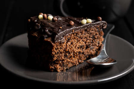 Piece of chocolate cake on dessert plate.