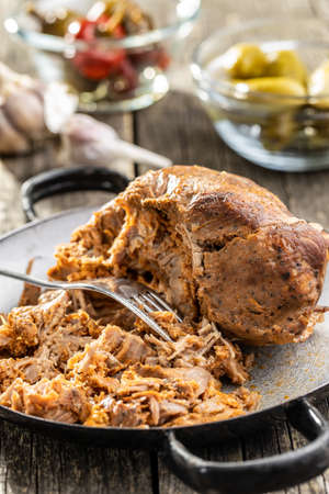 Pulled pork meat on pan.