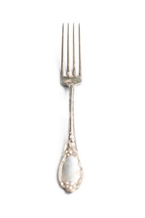 Antique silver fork isolated on a white background.の写真素材