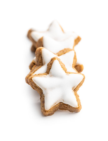 Icing gingerbread stars. Traditional Christmas cookies isolated on white background.の写真素材