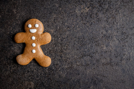 Xmas gingerbread man on black table. Top view.の写真素材