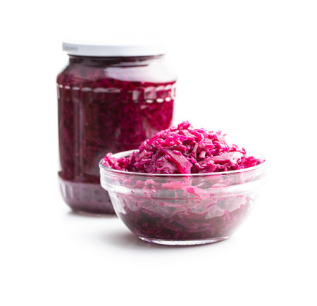 Red sauerkraut. Sour pickled cabbage in bowl isolated on white background.の写真素材