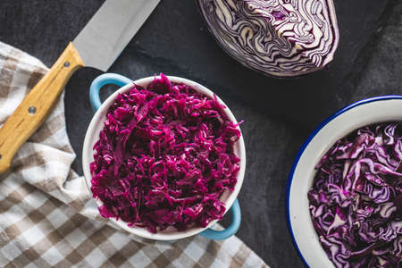 Red sauerkraut. Sour pickled cabbage in blue pot. Top view.の写真素材