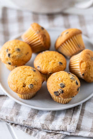 Vanilla muffins. Sweet cupcakes on plate.